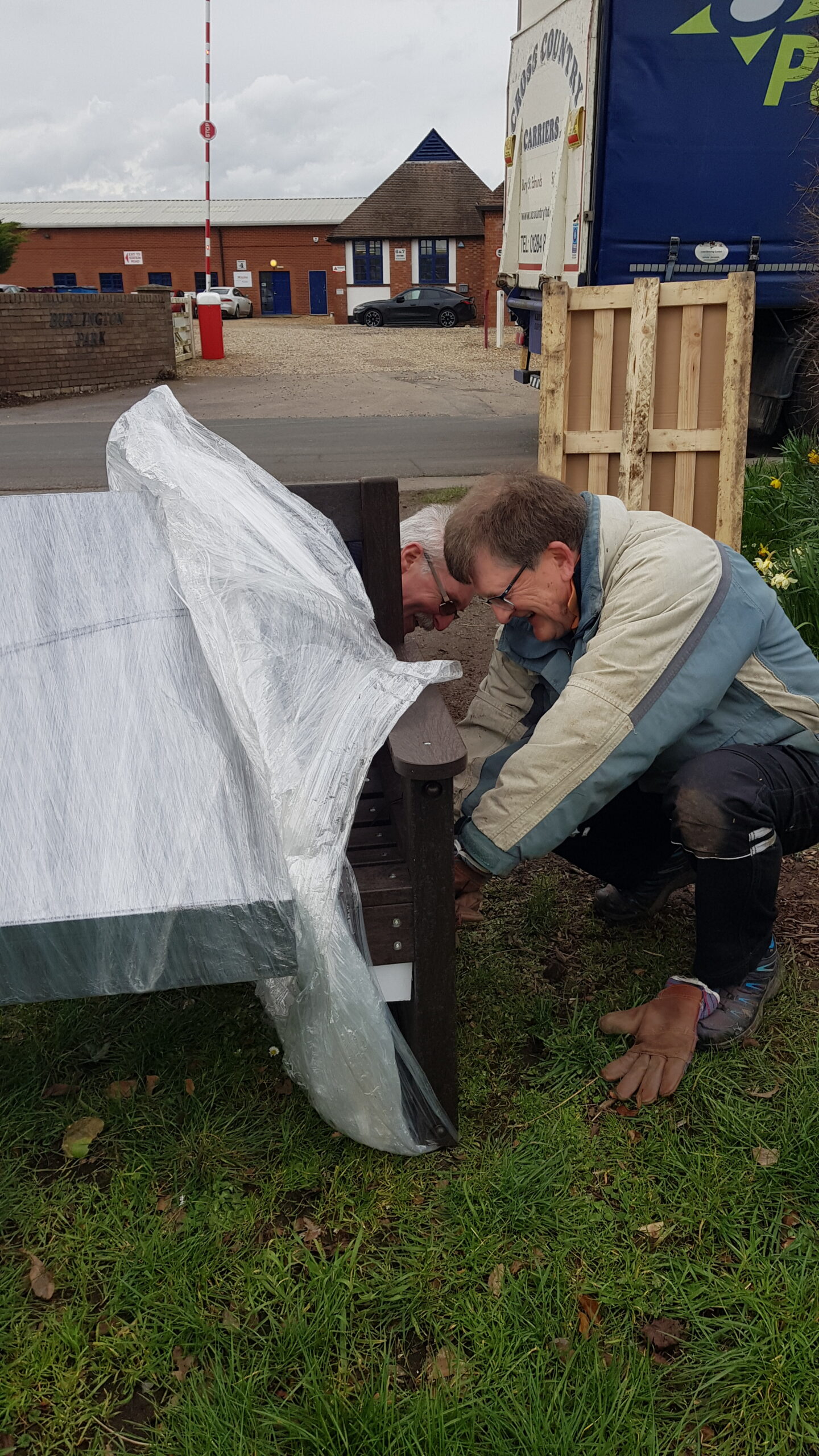 Dominic & Peter unpack the new bench (credit: Linda)