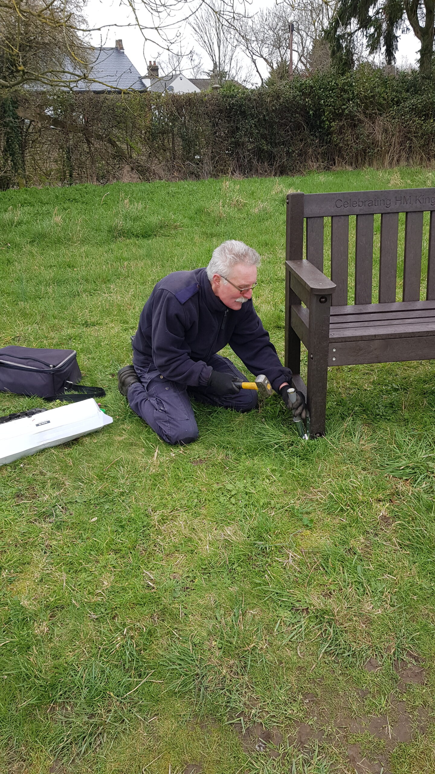 Peter fixing the new bench in position (credit: Linda)